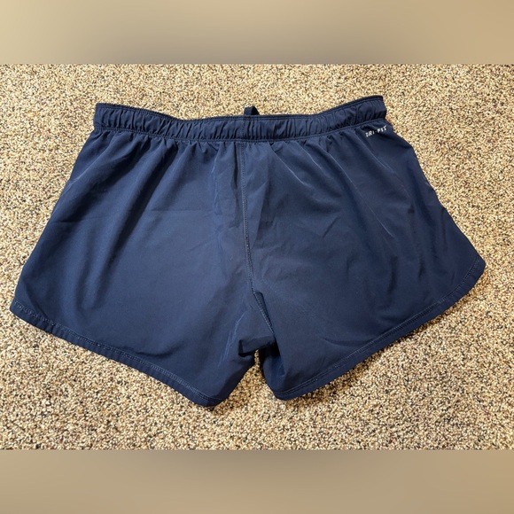 Nike Dri-FIT running shorts in navy blue with a teal waistband and trim large - Picture 4 of 5